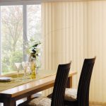 Dining room with dining table with vertical blinds